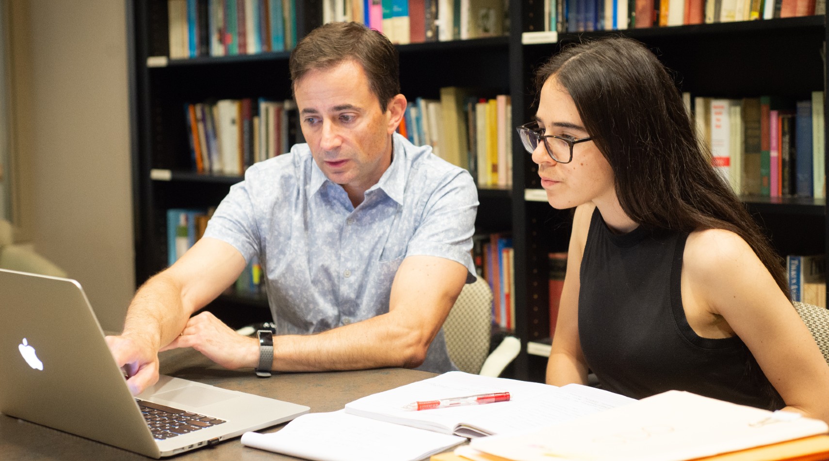 Professor Mark Sciutto works with a student on summer research.